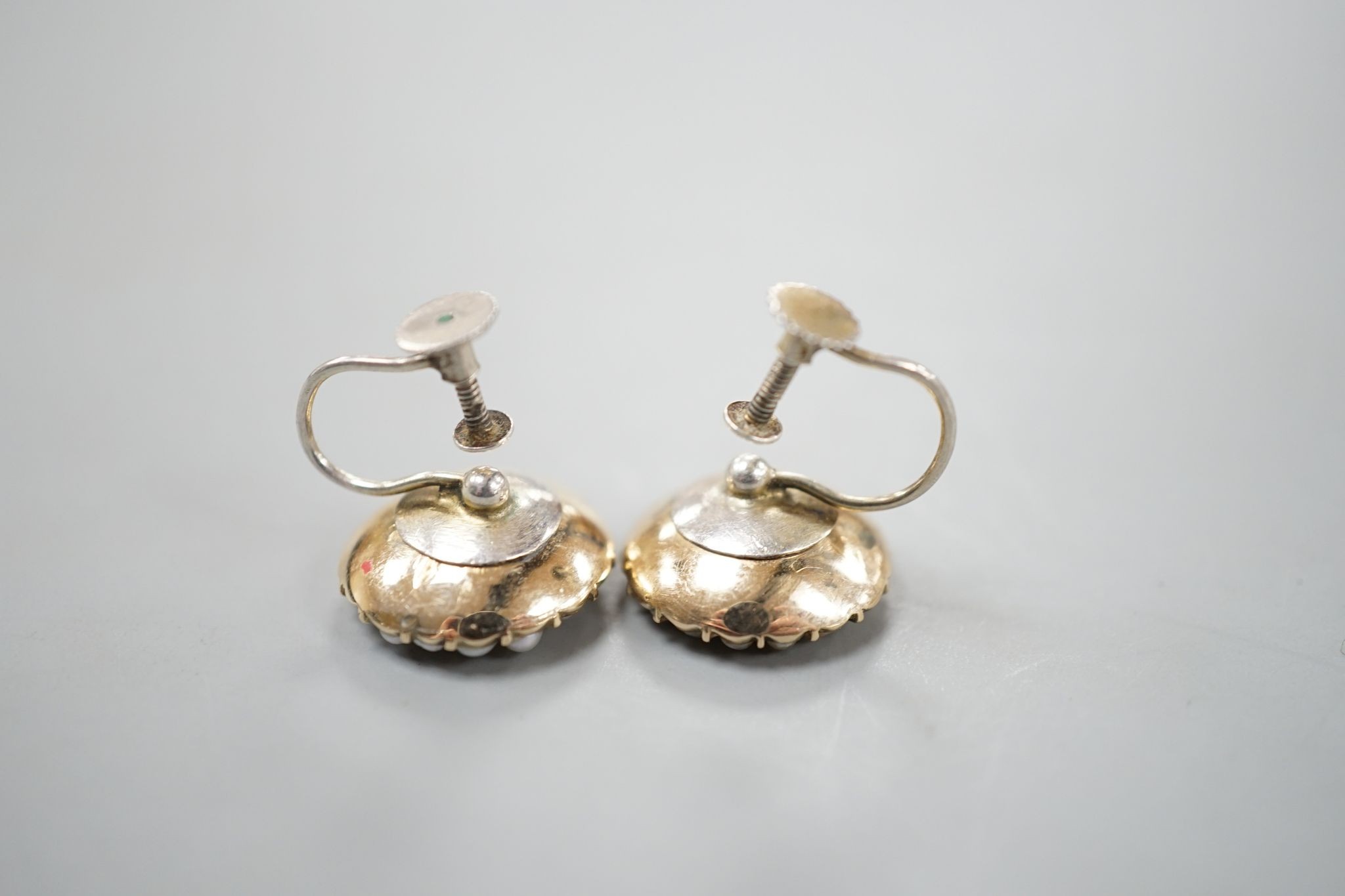 A pair of yellow metal, yellow topaz and split pearl set ear clips(adapted?), 14mm, gross 5.8 grams.